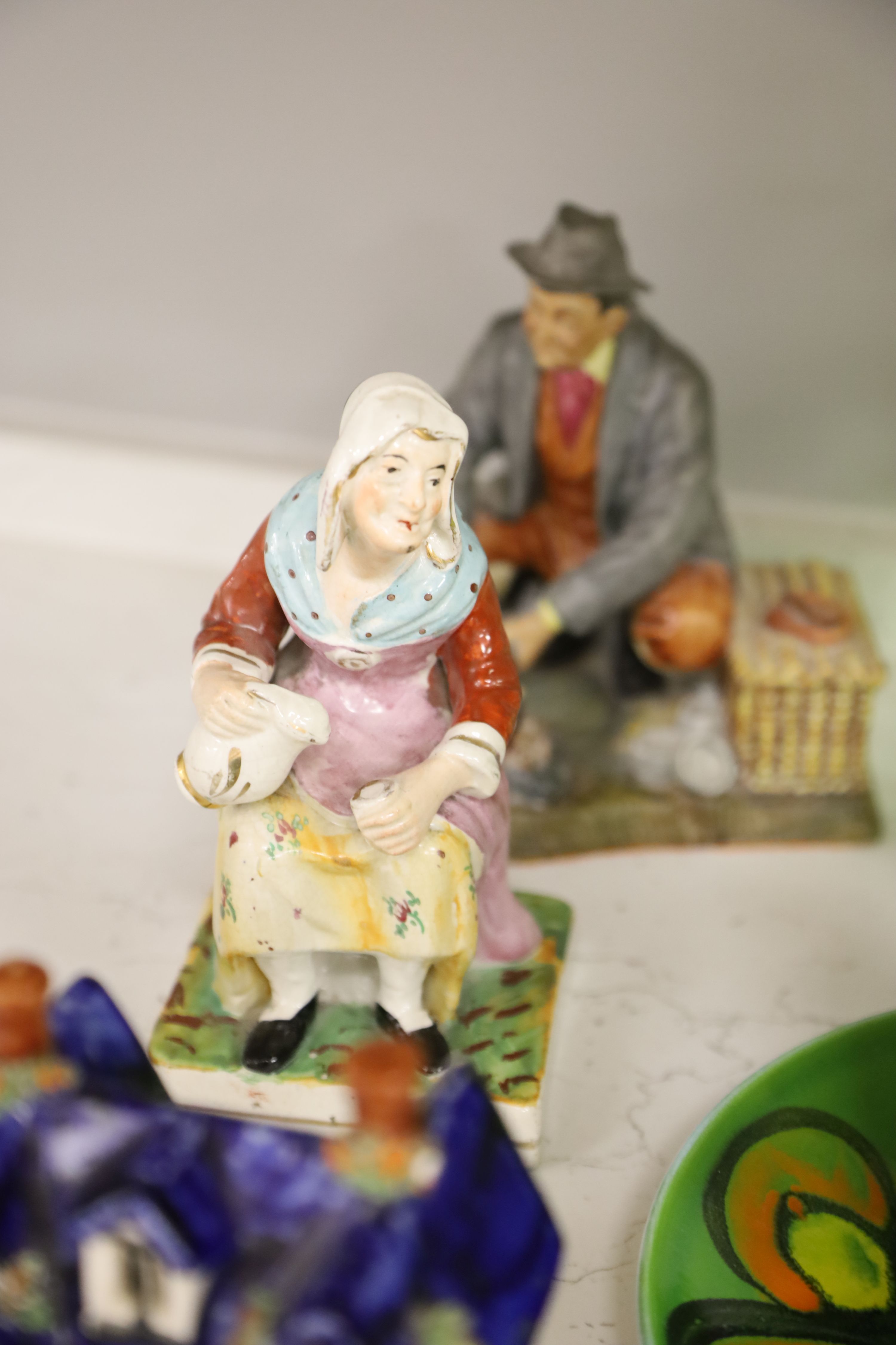 A quantity of mixed ceramics including Poole, Staffordshire, Goebel and a green glass decanter